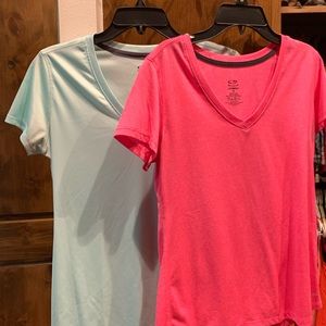 Two moisture wicking exercise shirts